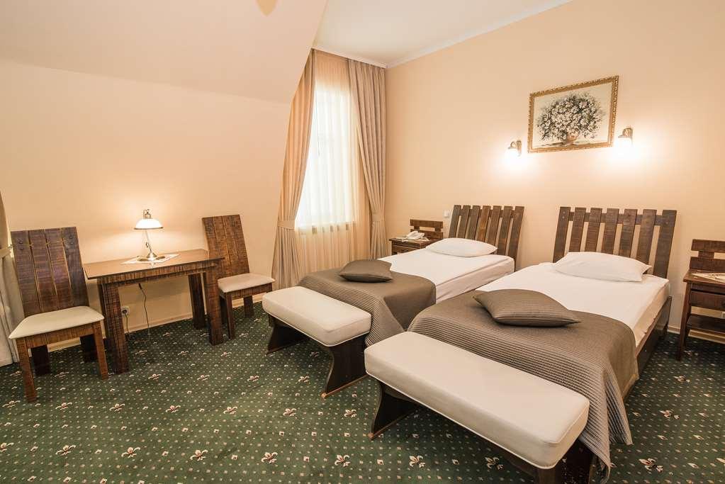 Premier Hotel Palazzo Полтава Стая снимка