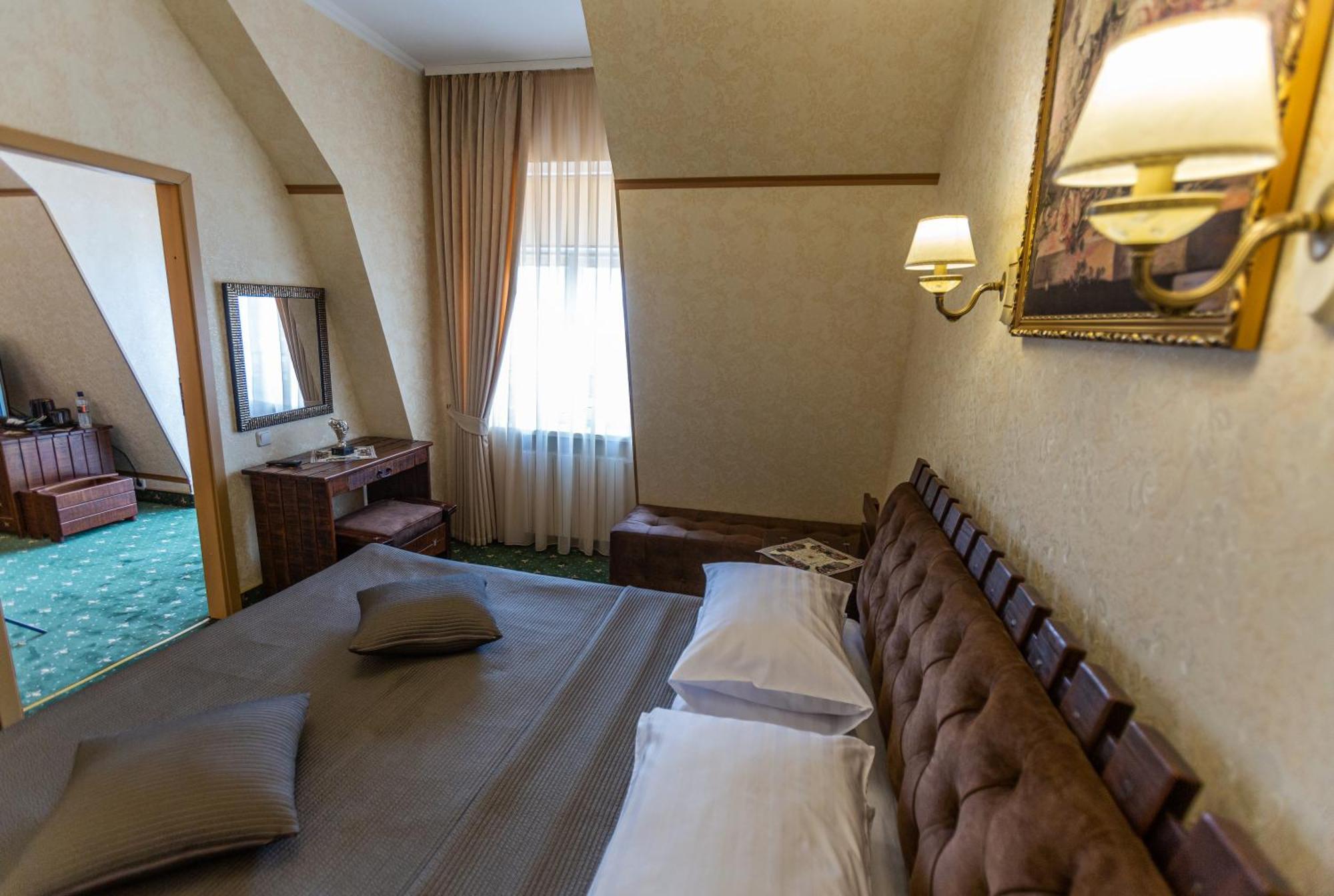 Premier Hotel Palazzo Полтава Стая снимка